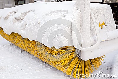 Snow remover machine with yellow brush Stock Photo