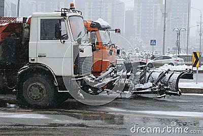 Snow removing equipement in the street in blizzard. Stock Photo