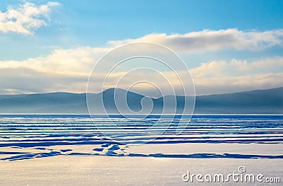 Snow on the river near the mountains Stock Photo