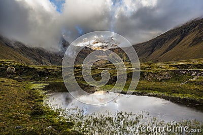 Snow, rocks and river in Collanes Valley in El Altar volcano Stock Photo