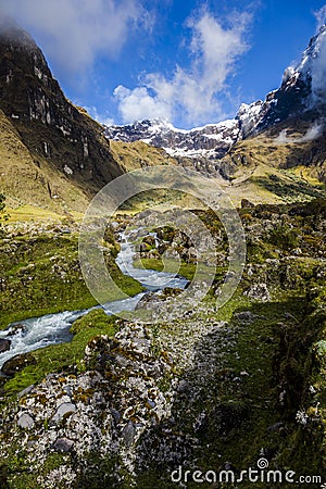 Snow, rocks and river in El Altar volcano Stock Photo