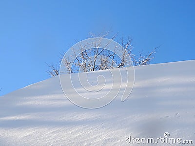 The snow and sky, a dazzling white and pale blue Stock Photo