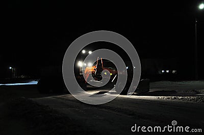 Snow truck silhouette working night cleaning city road Stock Photo