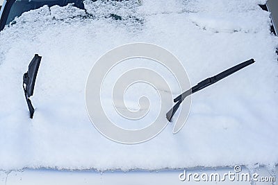Snow and wipers on front windshield Stock Photo