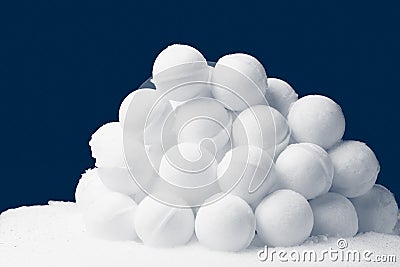 Snowballs heap on dark blue background Stock Photo