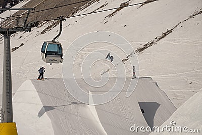 04.02.2022: Snowboard freestyle big air contest in Madonna di campiglio Snowboard tricks on kicker. Val Rendena dolomites Italy Editorial Stock Photo