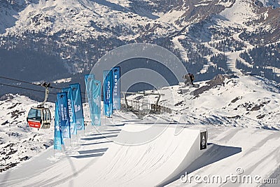 04.02.2022: Snowboard freestyle big air contest in Madonna di campiglio Snowboard tricks on kicker. Val Rendena dolomites Italy Editorial Stock Photo