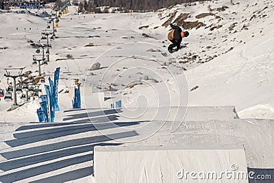 04.02.2022: Snowboard freestyle big air contest in Madonna di campiglio Snowboard tricks on kicker. Val Rendena dolomites Italy Editorial Stock Photo