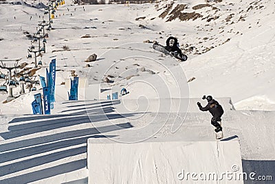 04.02.2022: Snowboard freestyle big air contest in Madonna di campiglio Snowboard tricks on kicker. Val Rendena dolomites Italy Editorial Stock Photo