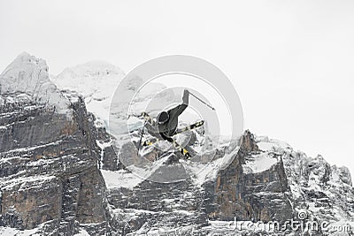 Snowboard ski freestyle big air contest in the background Mittelhorn mountain. Snowboard tricks, ski tricks. Jungfrau region Editorial Stock Photo