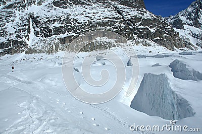 Snowboarder on crevasse field Stock Photo