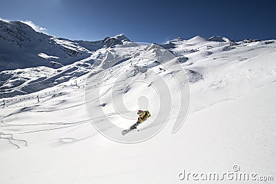 Snowboarder in deep powder, extreme freeride - austria Editorial Stock Photo
