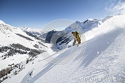 Snowboarder in deep powder, extreme freeride - austria Editorial Stock Photo