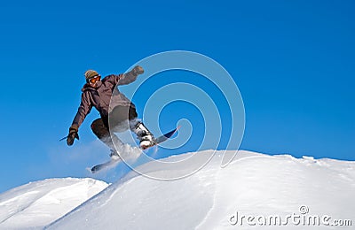 Snowboarder Jump In Air, Snow Flying Stock Photo