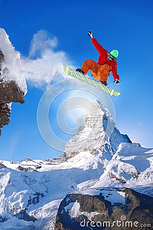 Snowboarder jumping against Matterhorn peak in Switzerland Stock Photo