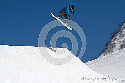 Snowboarder jumps in Snow Park, ski resort Stock Photo