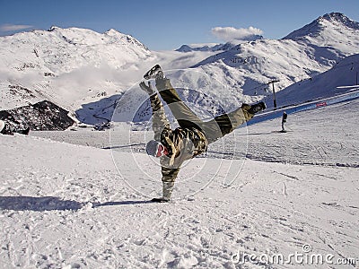 Snowboarder standing om one hand Editorial Stock Photo