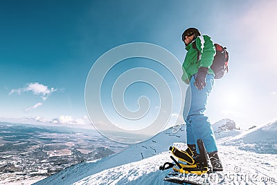 Snowboarder stay on the mountain top Stock Photo