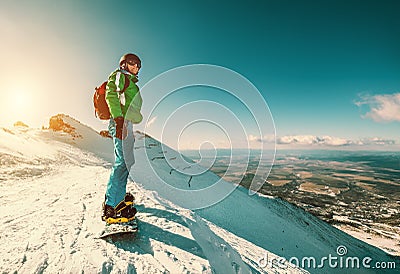 Snowboarder stay on the mountain top Stock Photo