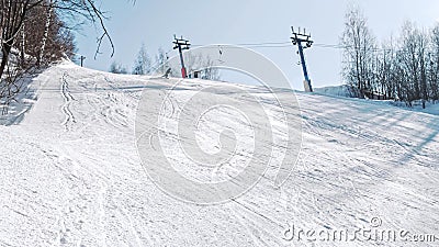Snowboarder technical carves down the hill and sprays snow in all directions. Stock Photo