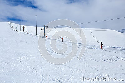 Snowboarders rising the mountain in russian polar ski resort Stock Photo