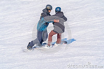 Snowboarders in a slope in alpine skiing in Mountain Air Resort, Yuzhno-Sakhalinsk, Russia Editorial Stock Photo