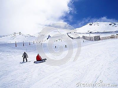 Snowboarders stopped in a snow piste Stock Photo