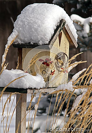 Snowcovered Birdhouse Stock Photo