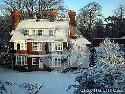 Snowcovered House on a Clear Day Stock Photo