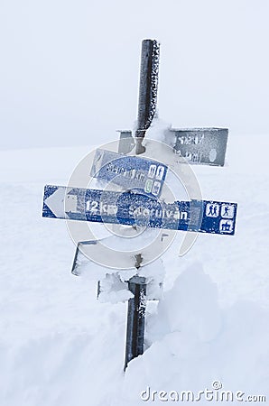 Snowcovered route sign Stock Photo