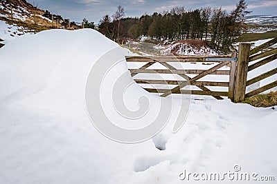Snowdrift over gate at Cawfields Quarry Stock Photo
