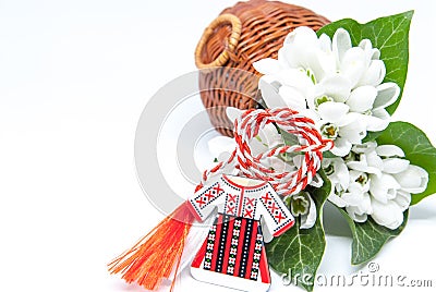 Snowdrops and red and white string martisor on white with copy space east european first of march tradition celebration Stock Photo