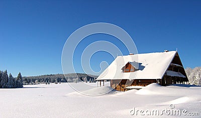 Snowed house in the mountains Stock Photo