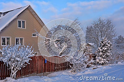 Snowed house in Russia Stock Photo