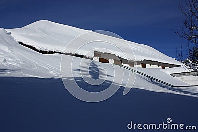 Snowed house, tena valley Stock Photo