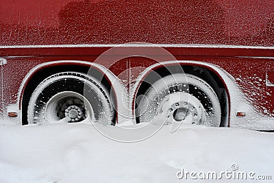 Snowed In Tires Of A Darkred Buss Stock Photo