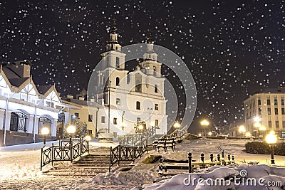 Snowfall in Minsk at winter night, Belarus. New Year and Christmas time in Minsk city. Cityscape of snowy Minsk Stock Photo