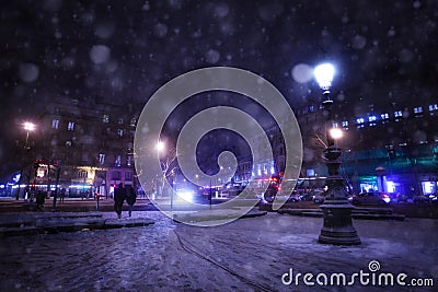 Snowfall on Republique square in Paris at night Stock Photo