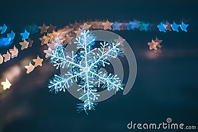 Snowflake with blurred color background. Stock Photo