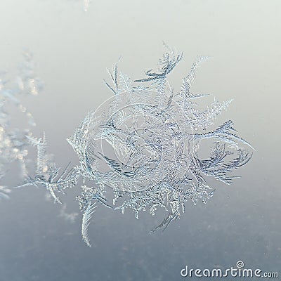 Snowflake close up on window glass at winter dawn Stock Photo
