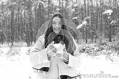 Snowing winter beauty fashion concept. Women in winter clothes. Outdoor close up portrait of young beautiful girl with Stock Photo