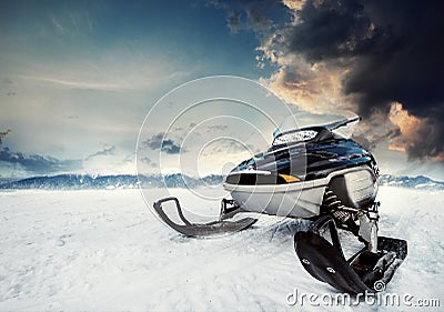 Snowmachine on the mountain lake frozen surface Stock Photo