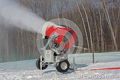 Snowmaking is the production of snow on ski slopes Stock Photo