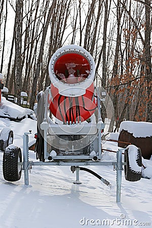 Snowmaking is the production of snow on ski slopes Stock Photo