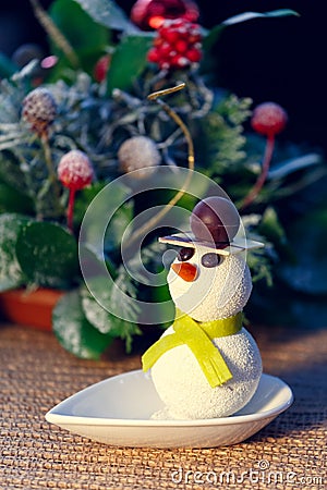 Snowman cake with Christmas decorations. Kids funny desserts and Stock Photo