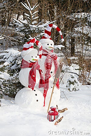 Snowman couple in love - christmas outdoor decoration with snow Stock Photo