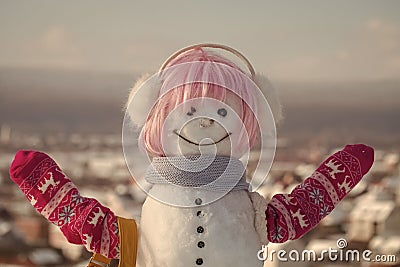 Snowman girl in winter pink wig hair with bag Stock Photo