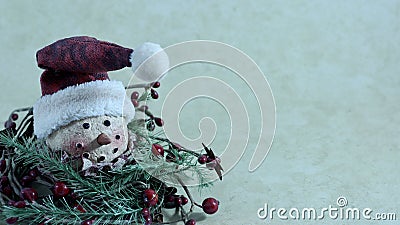 Smiling snowman head with a hat on a cream background Stock Photo