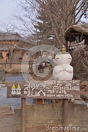 Snowman wooden direction signage Stock Photo