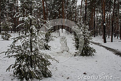 The snowman is made in the form of a rabbit. Winter park in Kyiv. Ukraine Stock Photo
